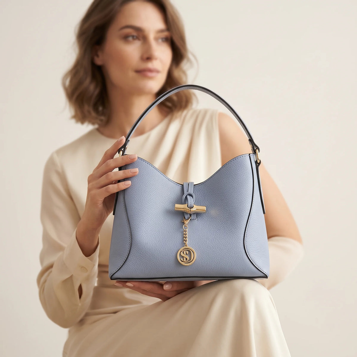 A woman holding a blue bag
