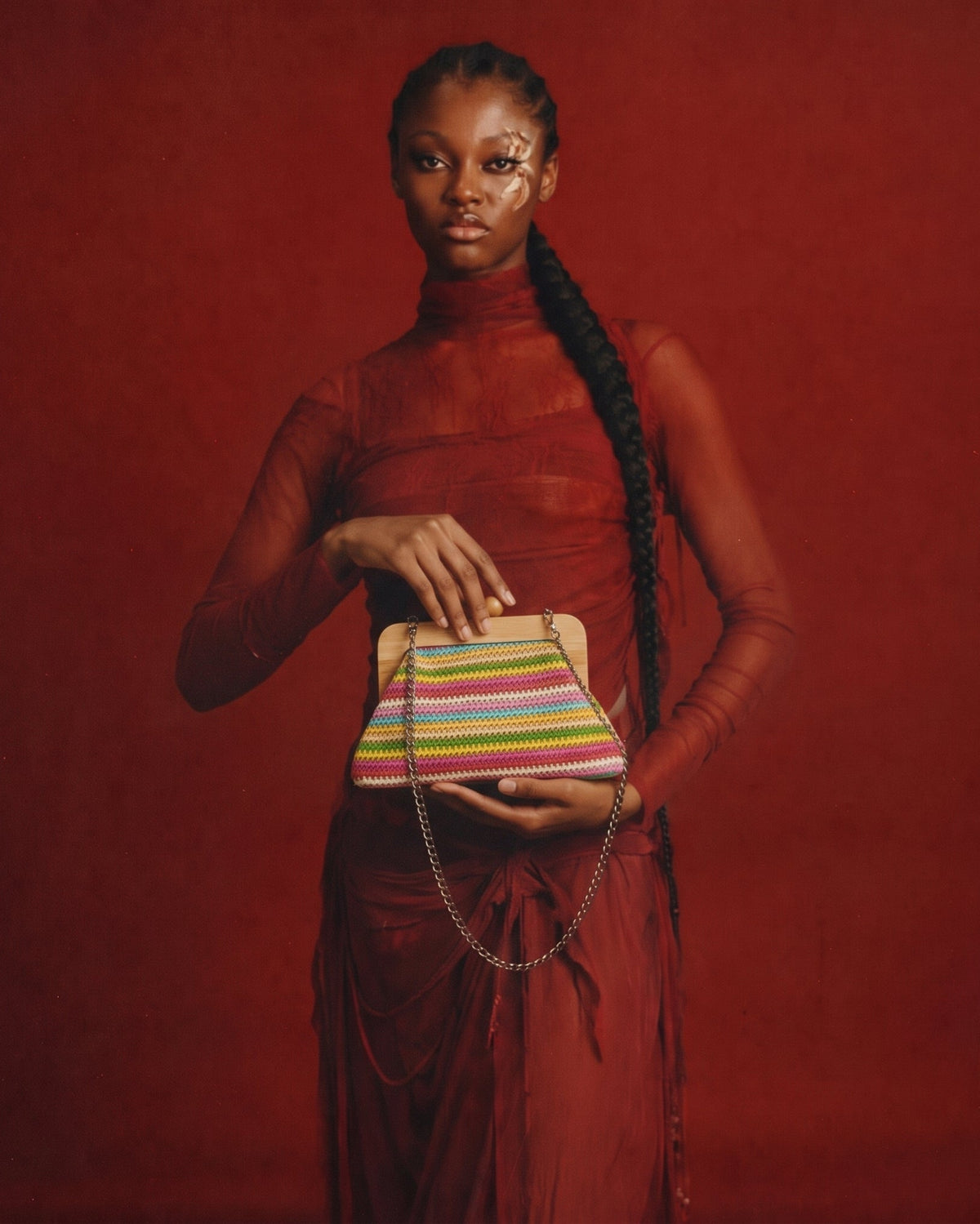 a woman holding a clutch bag
