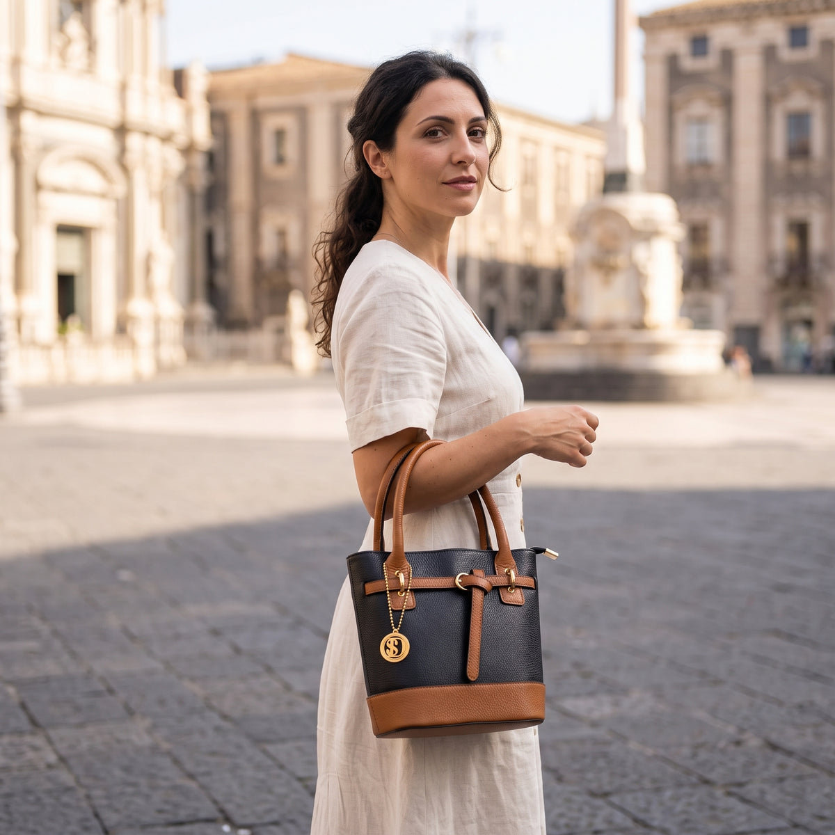 a woman holding a brown bag