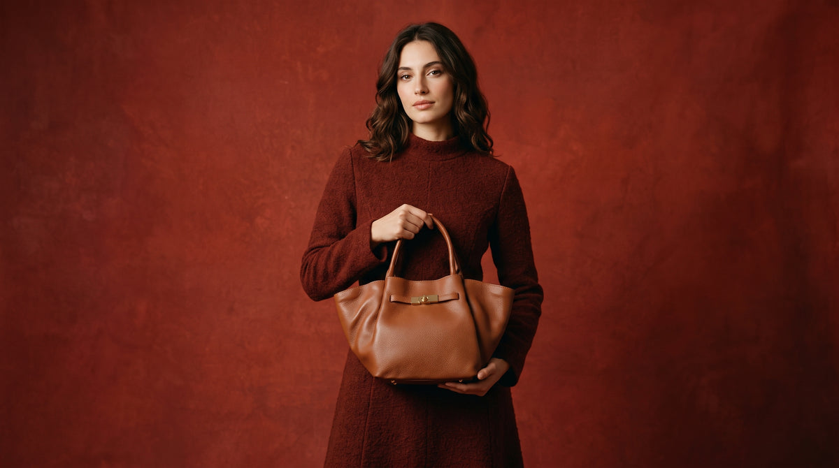 a woman holding a leather bag in red dress
