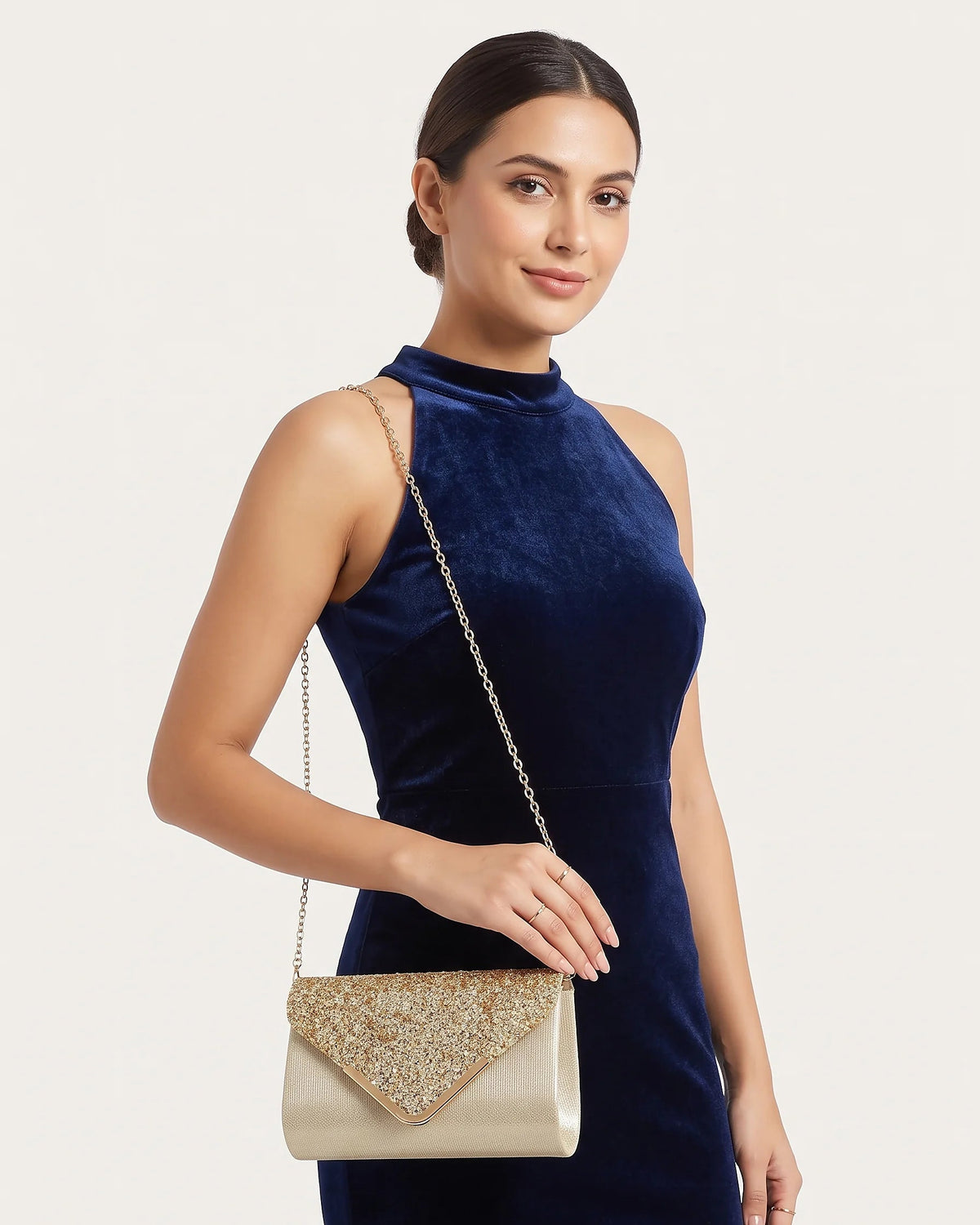 a woman holding an elegant bag
