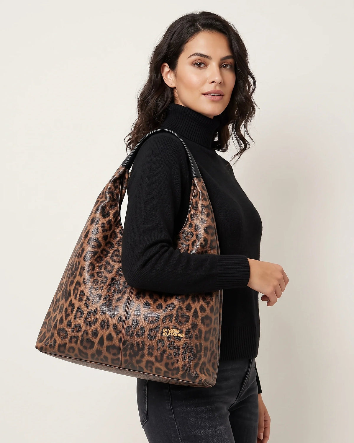a woman holding a large bag