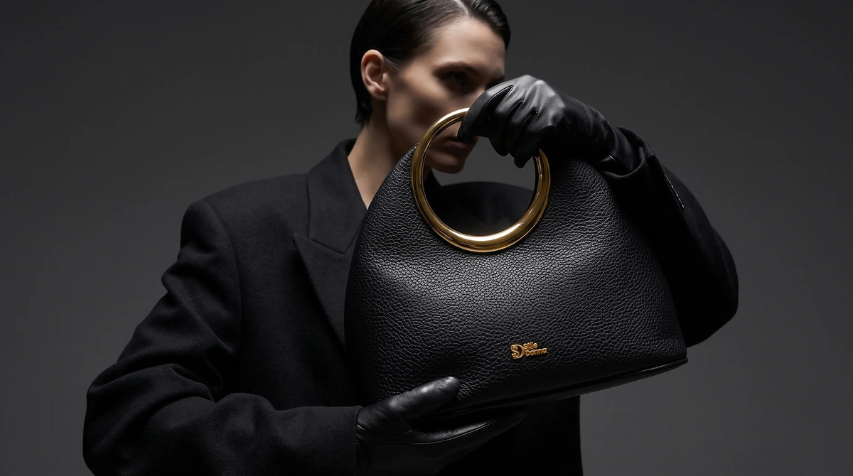 A woman carrying a leather bag